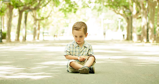 little boy sitting down