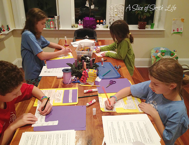 The Smith kids making a lapbook during school